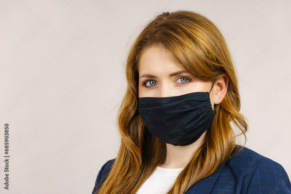 Woman using protective face mask. Woman using protective face mask.