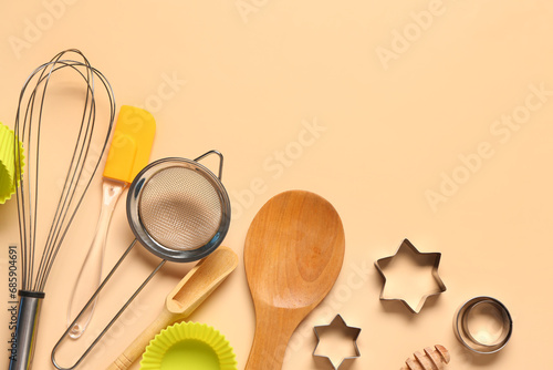 Baking utensils on beige background