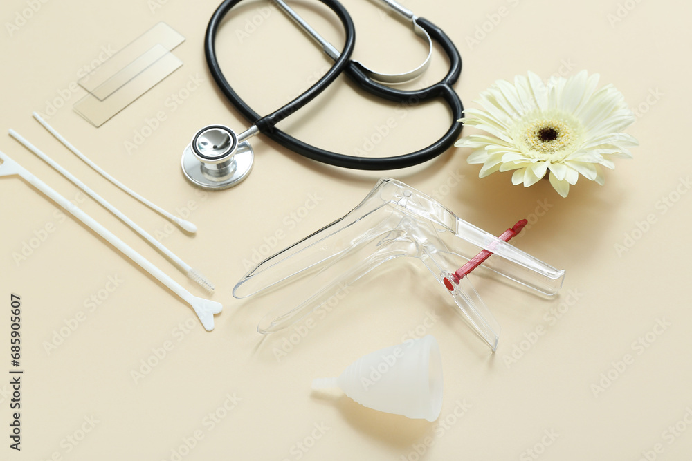Gynecological speculum, menstrual cup, stethoscope and pap smear test