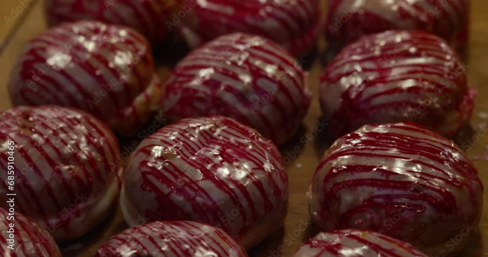 Christmas donuts with red glaze displayed at the Christmas market. Christmas donuts with red glaze displayed at the Christmas market.