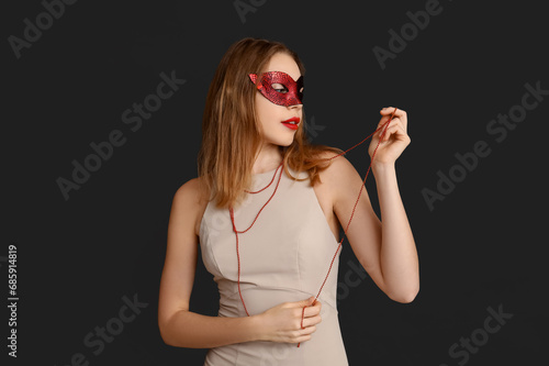Mysterious young woman wear...