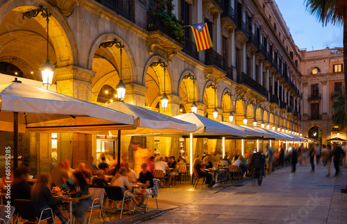 Photography Visitors at bars and restaurants at Placa Reial - square in Barri Gotic of Spani