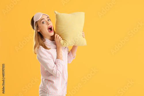Shocked young woman in slee...
