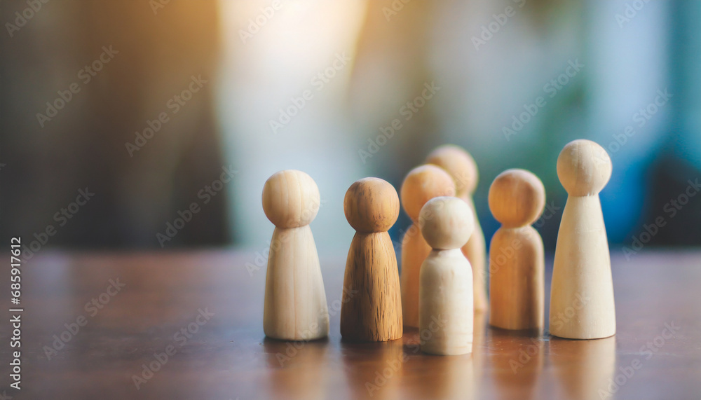 Group of diverse wooden figurines in a line, symbolizing unity, teamwork, and community in social gatherings, isolated on a wooden table background with Christmas decorations Group of diverse wooden figurines in a line, symbolizing unity, teamwork, and community in social gatherings, isolated on a wooden table background with Christmas decorations