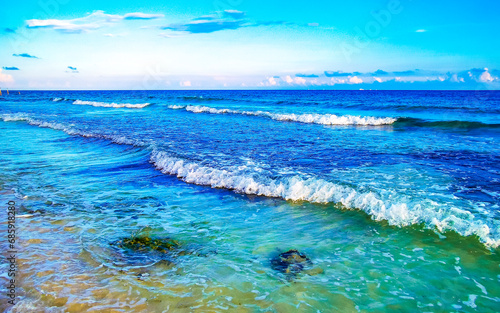 Stones rocks corals turquoise green blue water on beach Mexico.