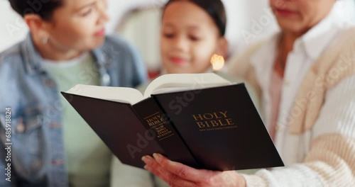 Religion, bible and family reading at their home for knowledge, faith and holy education. Spiritual, humble and people studying the book together for worship, trust and forgiveness at modern house. photo