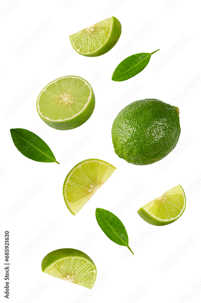 Falling limes with leaves on white background.