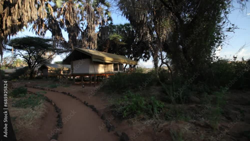 Steady cam down path in Kenya near isolated huts Steady cam down path in Kenya near isolated huts