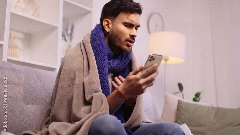 Sick young guy calling to doctor because coughing sneezing and having severe headache temperature at home Unhealthy handsome man distance remote talking with therapist indoors Sick young guy calling to doctor because coughing sneezing and having severe headache temperature at home Unhealthy handsome man distance remote talking with therapist indoors