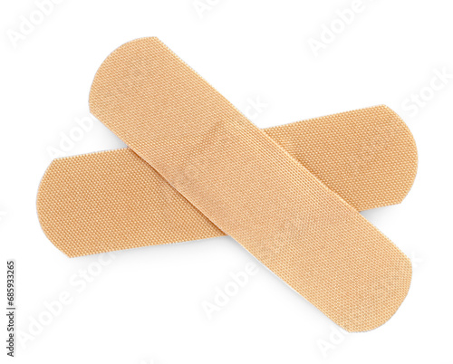 Medical adhesive bandages isolated on white, top view