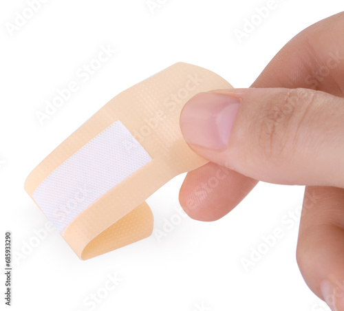 Woman with medical adhesive bandage isolated on white, closeup