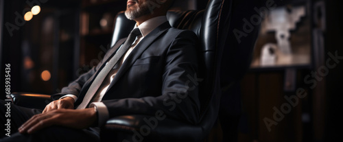 An image showcasing the concentrated focus of a suited man in a business environment, symbolizing dedication and professional acumen, banner