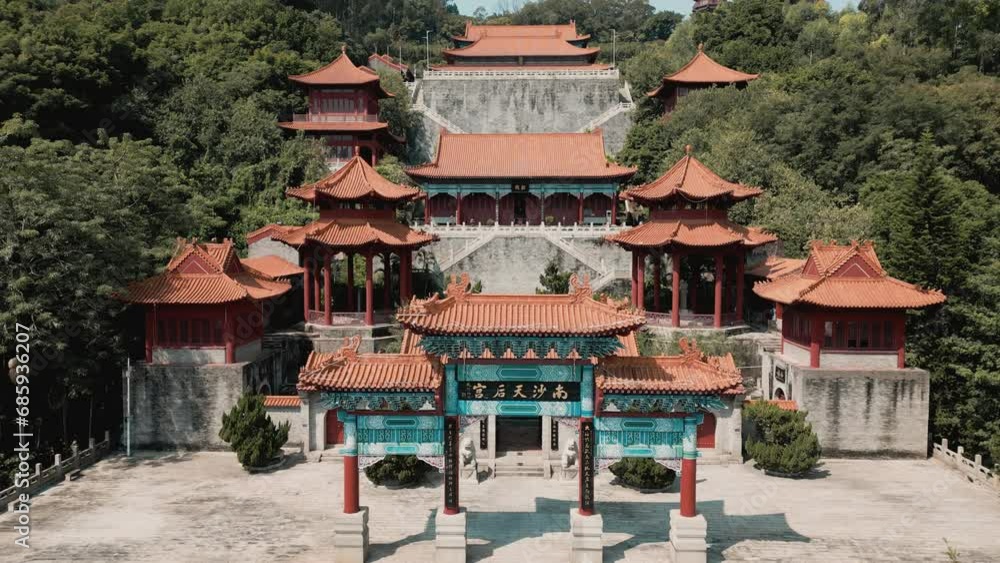 Marvel at the architectural splendor as our aerial drone gracefully pulls back, revealing the iconic Memorial Archway and Tin Hau Square at Nansha Tin Hau Palace Marvel at the architectural splendor as our aerial drone gracefully pulls back, revealing the iconic Memorial Archway and Tin Hau Square at Nansha Tin Hau Palace