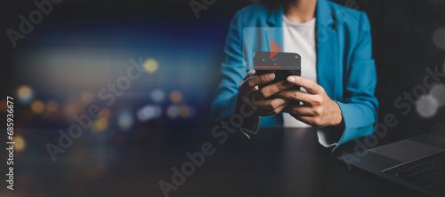 Person watching video clips on smartphones, streaming videos in smartphone applications, producing online video media from popular content creators on the platform, watching videos to relieve stress.