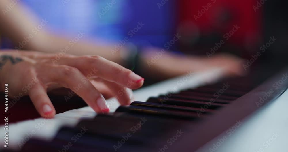 Abstract female hand playing keyboard instrument. Dj or music producer making audio tracks. Abstract female hand playing keyboard instrument. Dj or music producer making audio tracks.