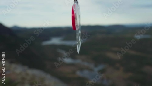 Orienteering Compass With Lanyard Swaying With The Wind. - close up photo