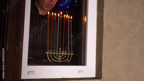 Hanukkah Celebrations. Lighting candles each night photo