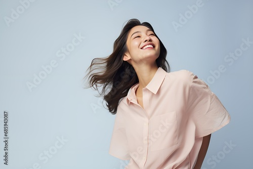 Portrait of a joyful fictional Japanese woman smiling. Graceful and elegant lady. Natural beauty. Happiness. Isolated on a plain colored pastel background. Generative AI.