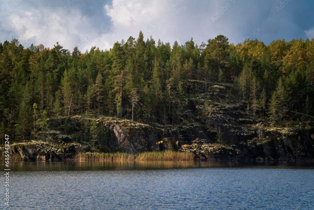 Naklejka premium Lake Ladoga near the village Lumivaara on a sunny autumn day, Ladoga skerries, Lakhdenpokhya, Republic of Karelia, Russia