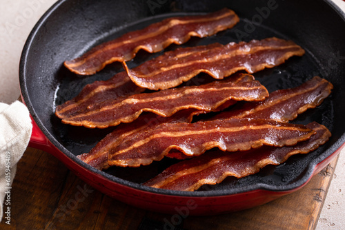 Turkey bacon cooked in a cast iron pan