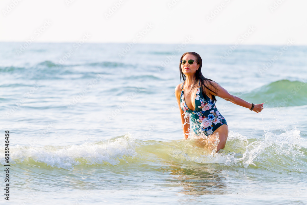 Woman body big with swimsuit relax at beach Woman body big with swimsuit relax at beach