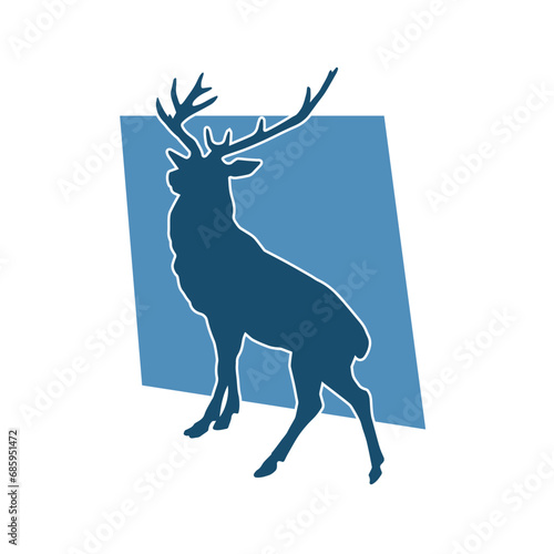 Silhouette of a wild deer forest animal with beautiful antlers.  photo