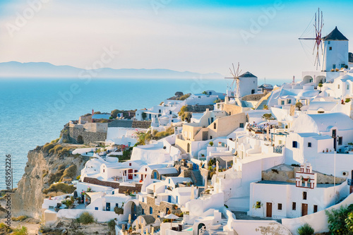 Oia village Santorini with blue domes and whitewashed house and a blue sky at the Island of Santorini Greece Europe, Santorini Cyclades Island Aegean sea