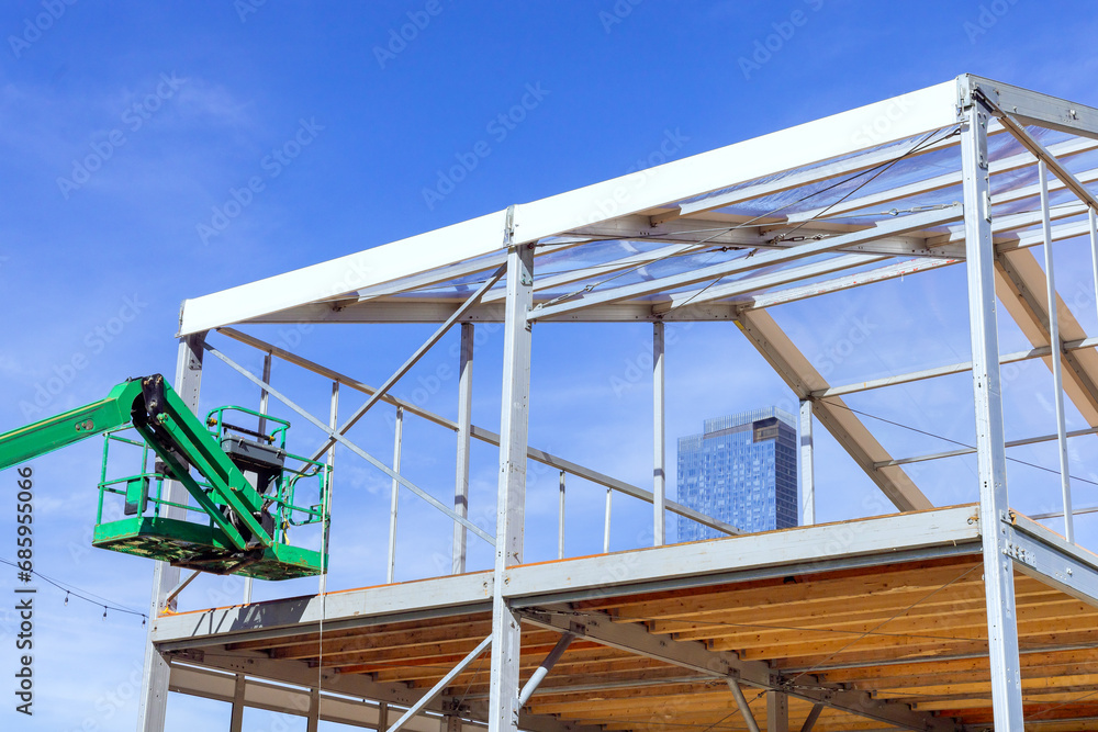 Currently, steel framework frame beams are being erected for an industrial commercial building Currently, steel framework frame beams are being erected for an industrial commercial building
