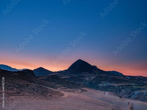 Mount Timios Stavros above harvested fields at dawn, Plakias, Crete, Greece, Europe photo