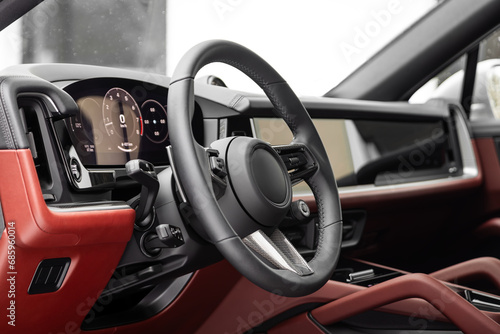 car Interior - steering wheel, shift lever and dashboard, climate control, speedometer, display  in luxury car. © Виталий Сова