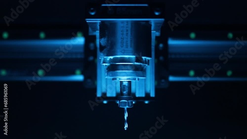 cnc router, spindle, stepper motors, close-up, dark background, blurred photo