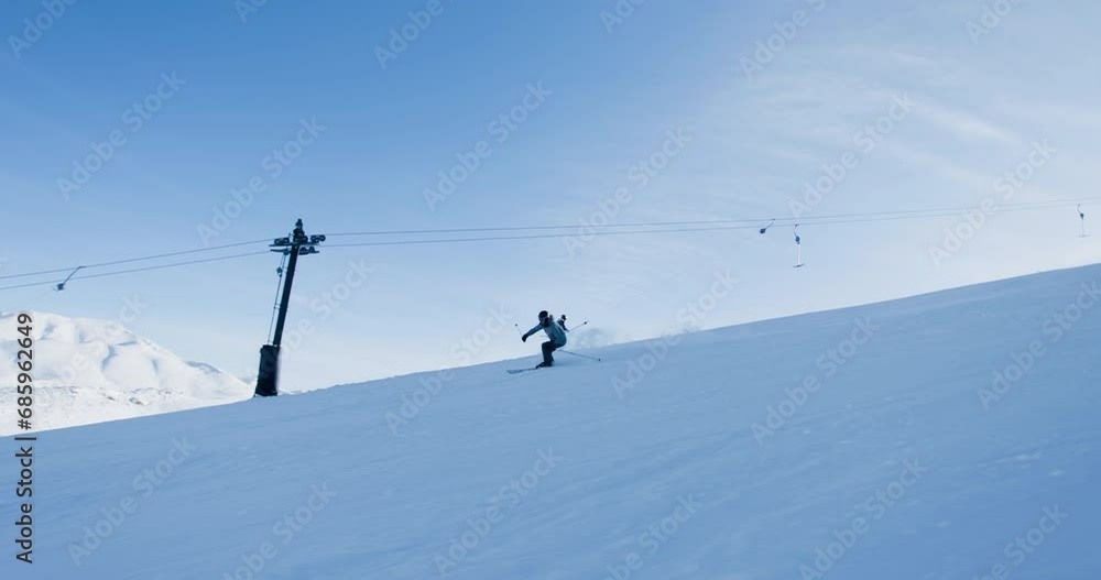 Experienced male skier skiing on slopes on a ski center. Recorded at 120 fps. Experienced male skier skiing on slopes on a ski center. Recorded at 120 fps.