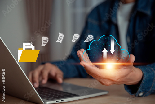 Businessman is using a laptop to access the cloud computing system , Storage and data transfer Cloud network , Cloud technology. Networking and internet service concept.
