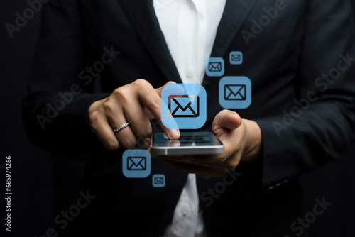 Email marketing concept. Hand of businessman using smartphone , tablet, for email virtual screen. Business digital technology and marketing. 