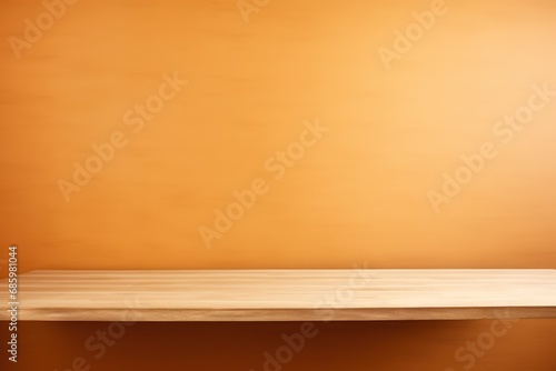 An empty table against a bright brown wall background. Wooden desk.