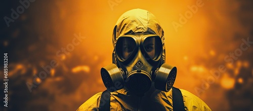 Person wearing respirator in front of radioactive backdrop, symbolizing radiation. photo