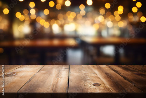 Wooden table top on blurred pub background with bokeh lights - mockup for product display or montage