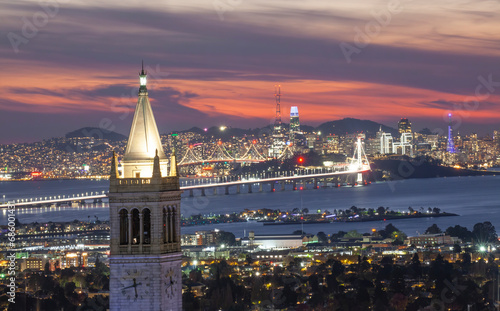 Sather Tower in UC Berkeley and San Francisco City Skyline at Sunset photo