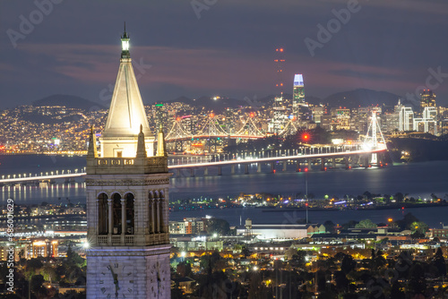 Sather Tower in UC Berkeley and San Francisco City Skyline at Sunset photo