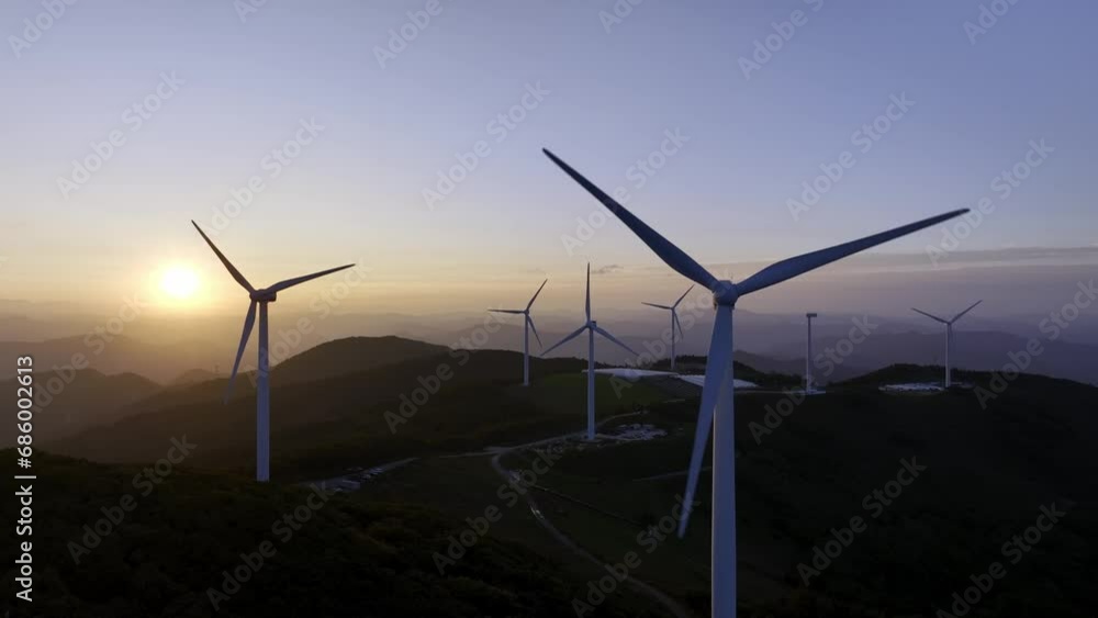 Wind power generator on the mountain against the background of the sunrise. 풍력 발전기, 풍력 터빈, 일출.
Wind power generator on the mountain against the background of the sunrise. 풍력 발전기, 풍력 터빈, 일출.