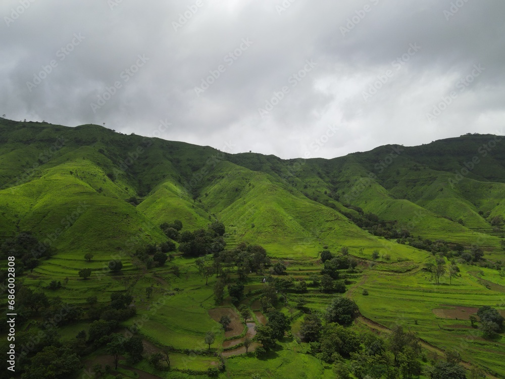 aerial shot  of lush green mountains in monsoon season. western ghats of India. 