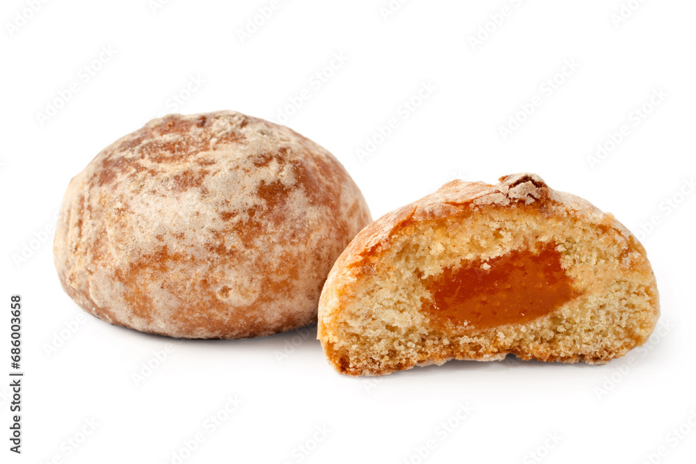 Gingerbread with filling on a white background. Half a gingerbread cake with jam. Gingerbread with filling on a white background. Half a gingerbread cake with jam.