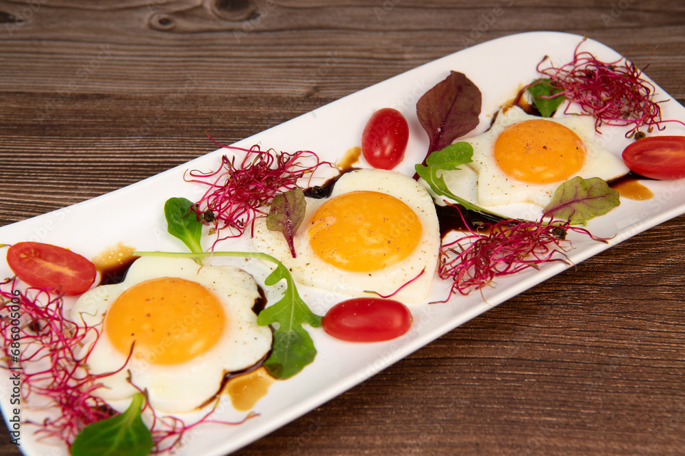 RECIPE FOR FRIED EGGS AND POMEGRANATE MOLASSES CUT INTO HEARTS, STARS AND FLOWERS. High quality photo RECIPE FOR FRIED EGGS AND POMEGRANATE MOLASSES CUT INTO HEARTS, STARS AND FLOWERS. High quality photo