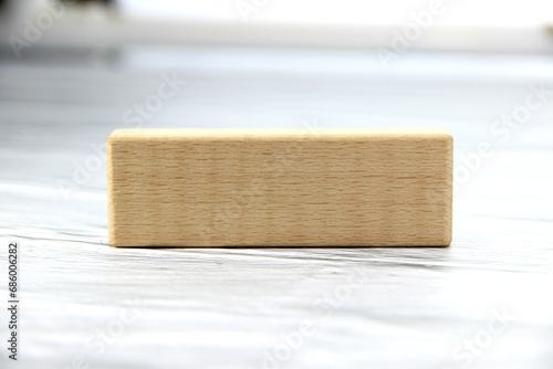 Empty wooden block for text or message short word letter on wood pantern background.Copy space. photo