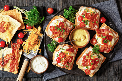 Kentucky Hot Brown open sandwiches on a plate photo