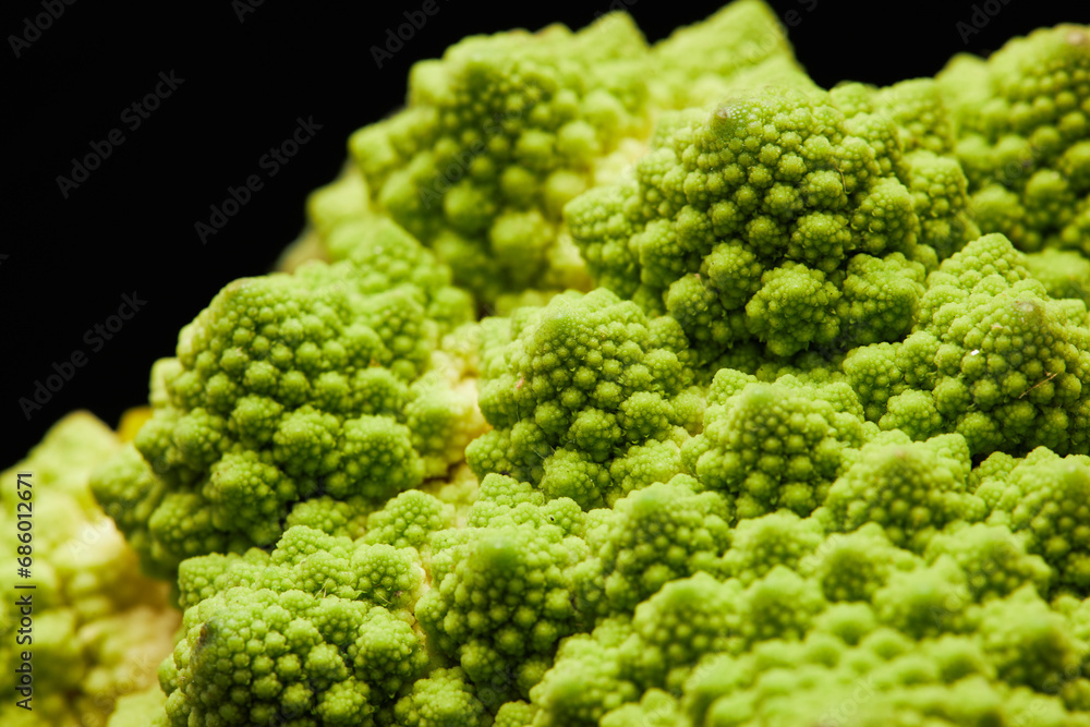 Close up detail shot of romanesco cauliflower with fractal spikes, copy space