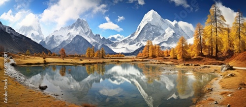 Yading reserve, China, with space for text over Pearl Lake's horizontal image background.