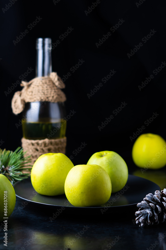 Obraz premium A ripe green apple fruits on dark stone table. Top view with copy space. Flat lay