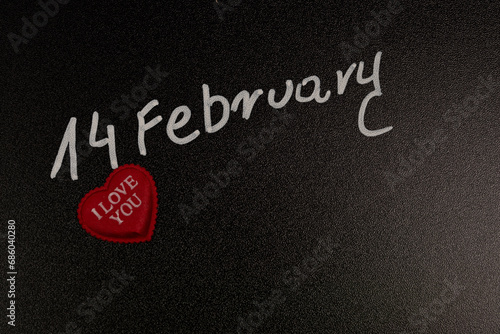 Background with the inscription February 14 and a red heart, background for Valentine's Day