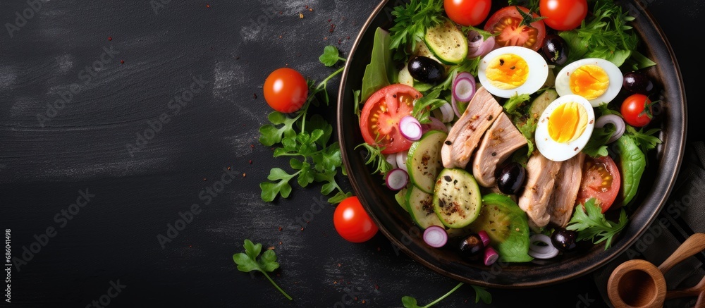 Keto-friendly salad with tuna, quail eggs, vegetables, and selective focus, viewed from above. Keto-friendly salad with tuna, quail eggs, vegetables, and selective focus, viewed from above.